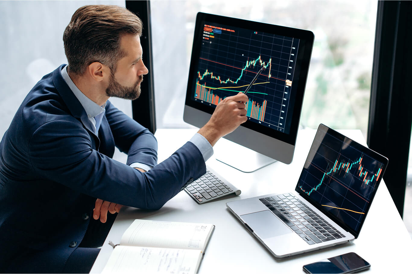 Investor analyzing commodity trading charts and market trends