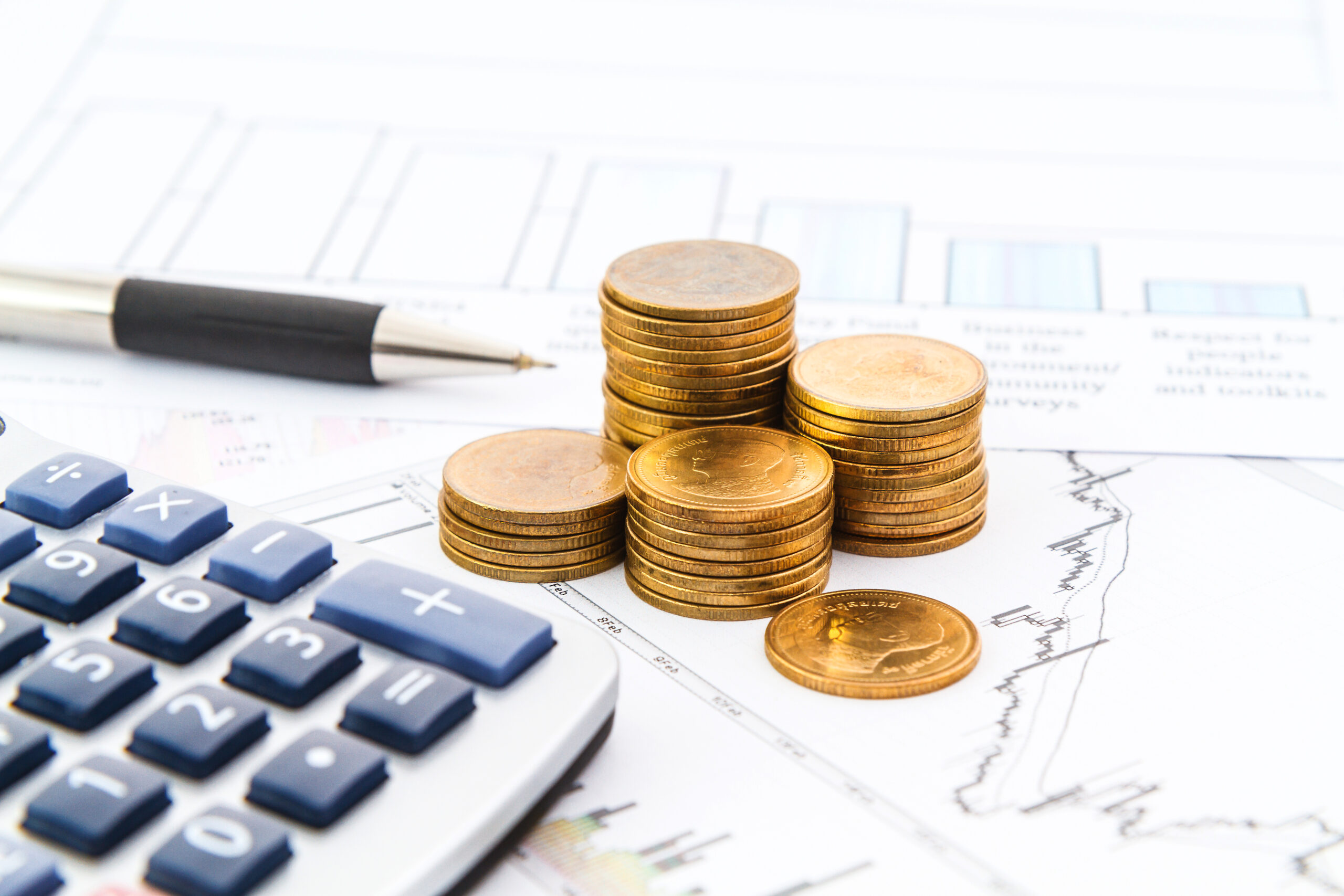 Stacked coins on market chart symbolizing diversified commodity growth