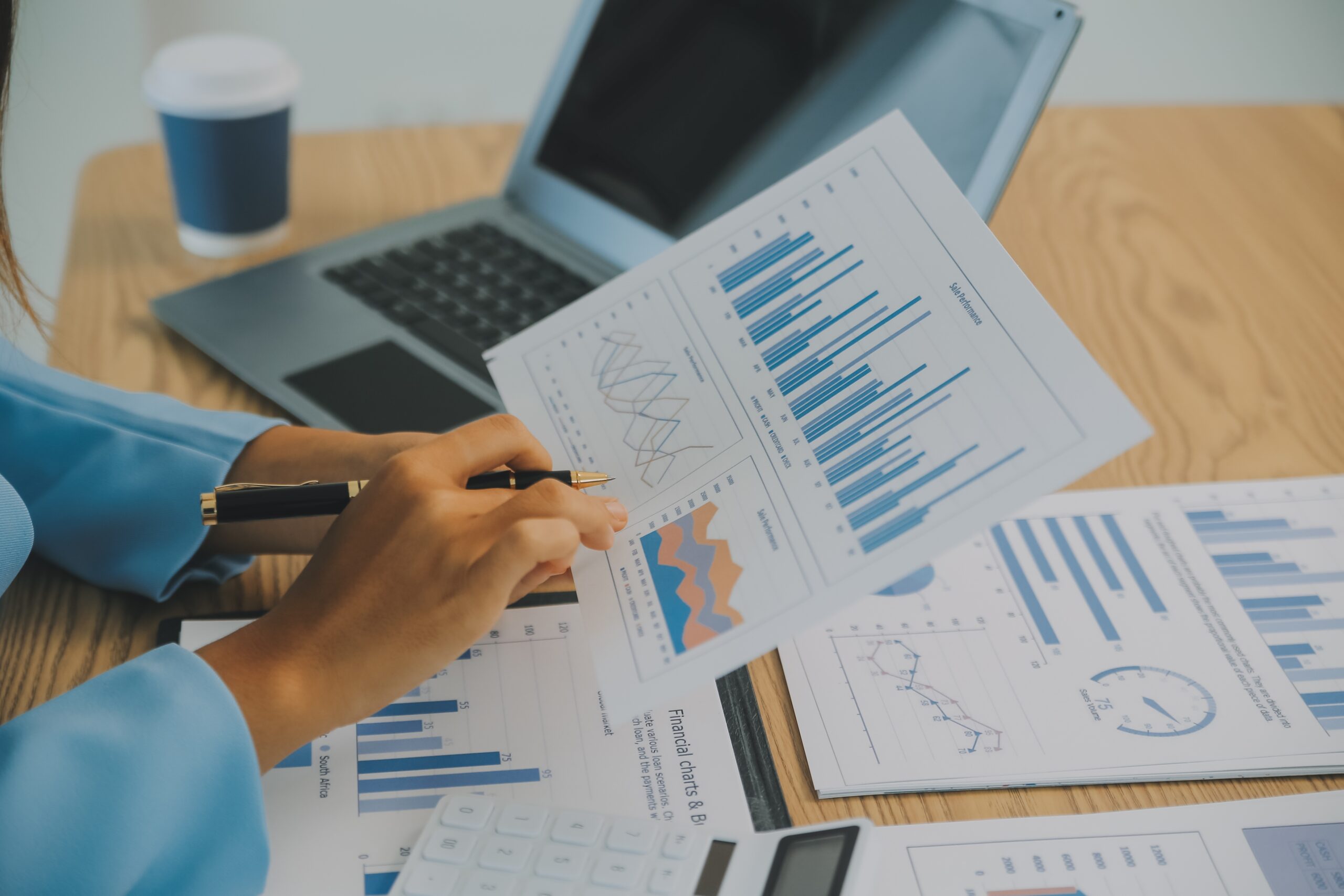 Analyst reviewing spread trading program data and charts